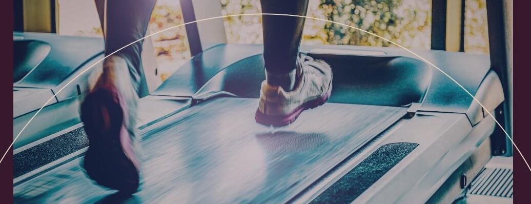 Someone's Sneakers Walking On A Treadmill.