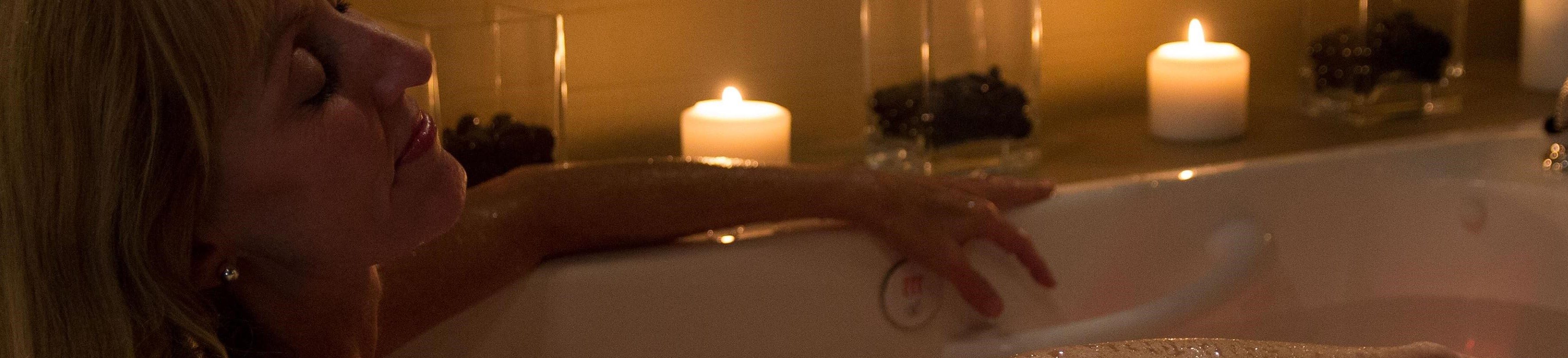 woman laying in a walk in tub for the elderly